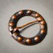 Vintage small brooch styled as penannular brooch.