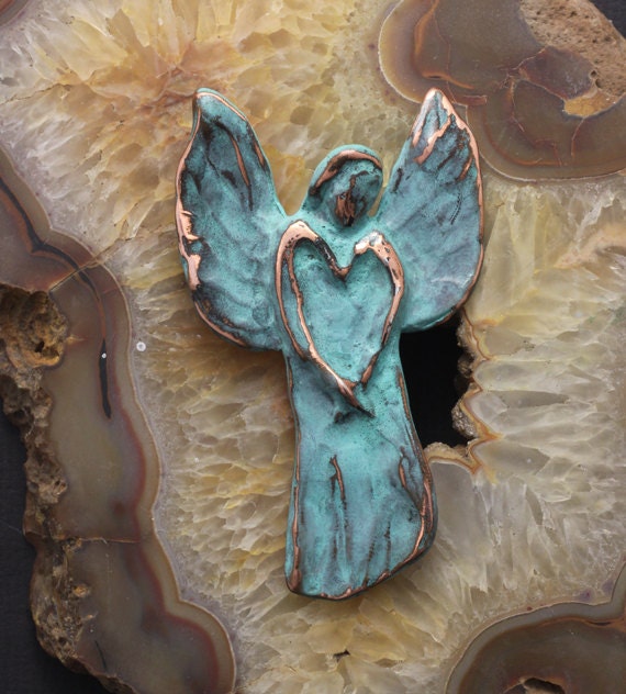 Angel wall sculpture in pewter and copper with blue green patina