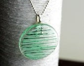 Pearl Green Stripes on a Round Glass Pendant