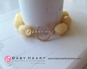 Crystal and gold vermeil LUCKY HORSESHOE charm bracelet on white stone