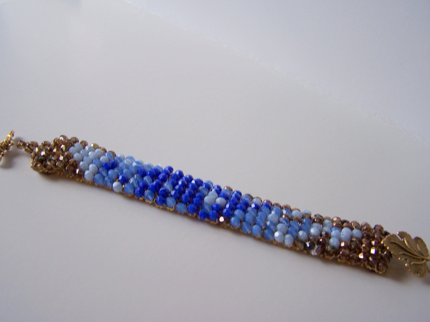 unique beadweaving crystal bracelet, handmade, amazing, topaz, blue crystals, brass ivy, elegant, abstract crystal design, glamorous OOAK
