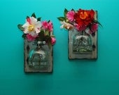 floating vases made from recycled bottles and repurposed wood