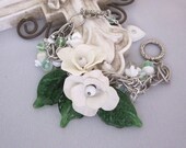 Repurposed Flower Statement Bracelet, White Beaded Charm Bracelet, Green Glass Leaves, Handmade Assemblage OOAK  Jewelry - JryenDesigns