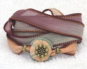 Silk Whirly Wrap Bracelet with peach sari silk wrapped accent and secure magnet pastels peach lilac and mint