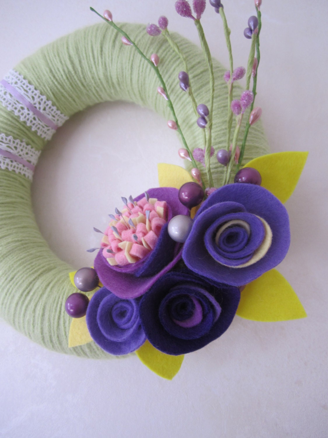 Green Yarn Wreath with Purple Felt Flowers 8"