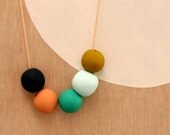 not quite round handmade beads make a necklace