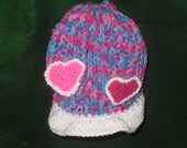 Valentines Day Themed Brimmed Childs Hat. Hand Knitted with Pink and Red Crocheted Hearts.