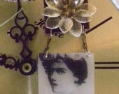 Layered assemblage mixed media with vintage flower earring and romantic image