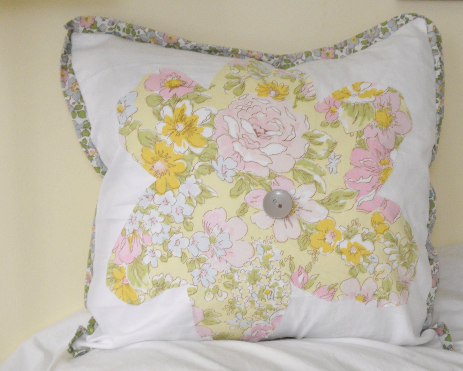 Pillow sham with vintage sheet flower applique