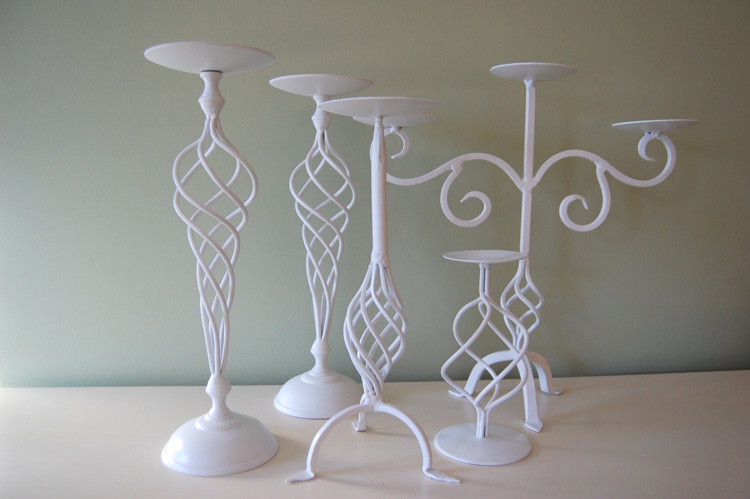 Collection of 5 Elegant Salvaged Lightly Distressed White Candle Holders with a Delicate Swirl Pattern