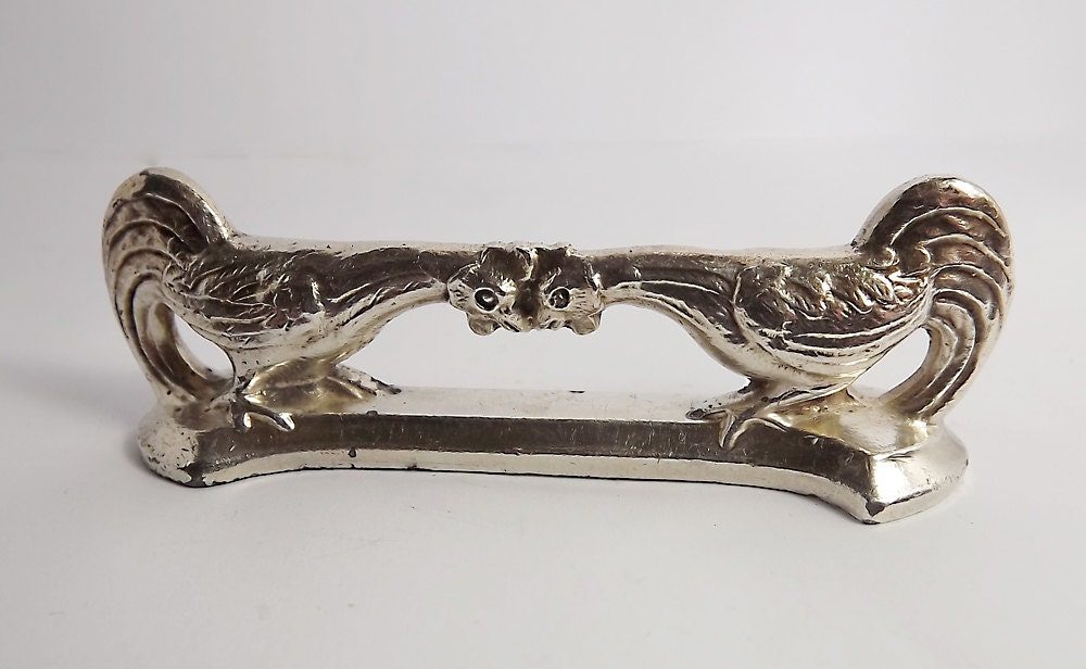 Antique pair of silver plated rooster knife rests