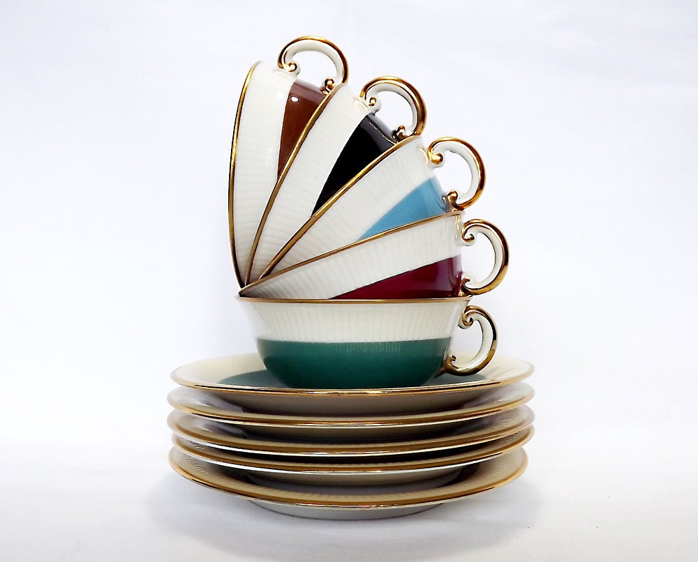 Five harlequin cups and saucers with gold interiors made by Pillivuyt, France