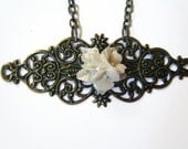 Antiqued gold filigree necklace with resin flowers