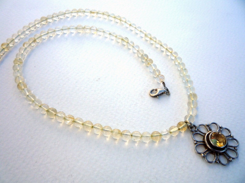 Citrine semiprecious gemstones necklace with Sterling Silver flower Citrine pendant.