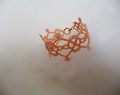 Handcrafted  bracelet  light peach with beads.