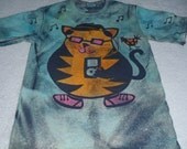 Cool cat variation, cat with pink glasses, ipod, hat, shoes, and funky bird on the tail, man's small discharge t-shirt with procion dyes