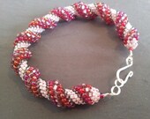 Hand woven seedbead 'Rasberry Ripple' bracelet. SRA