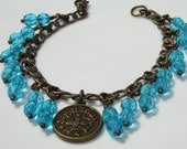 Antique Brass Zodiac Light Blue/ Topaz Sagittarius Charm Bracelet