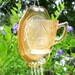 Depression Glass Iris and Herrinbone Tea Cup Suncatcher Yard Garden Art with Glass Wind Chimes