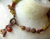 Rustic tribal amulet choker necklace silk wrapped, organic beads and clay amulets
