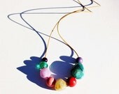 Chunky bead necklace, swing, sage green, purple, peach, teal and red, intergalactic 1940s colours, galaxy.