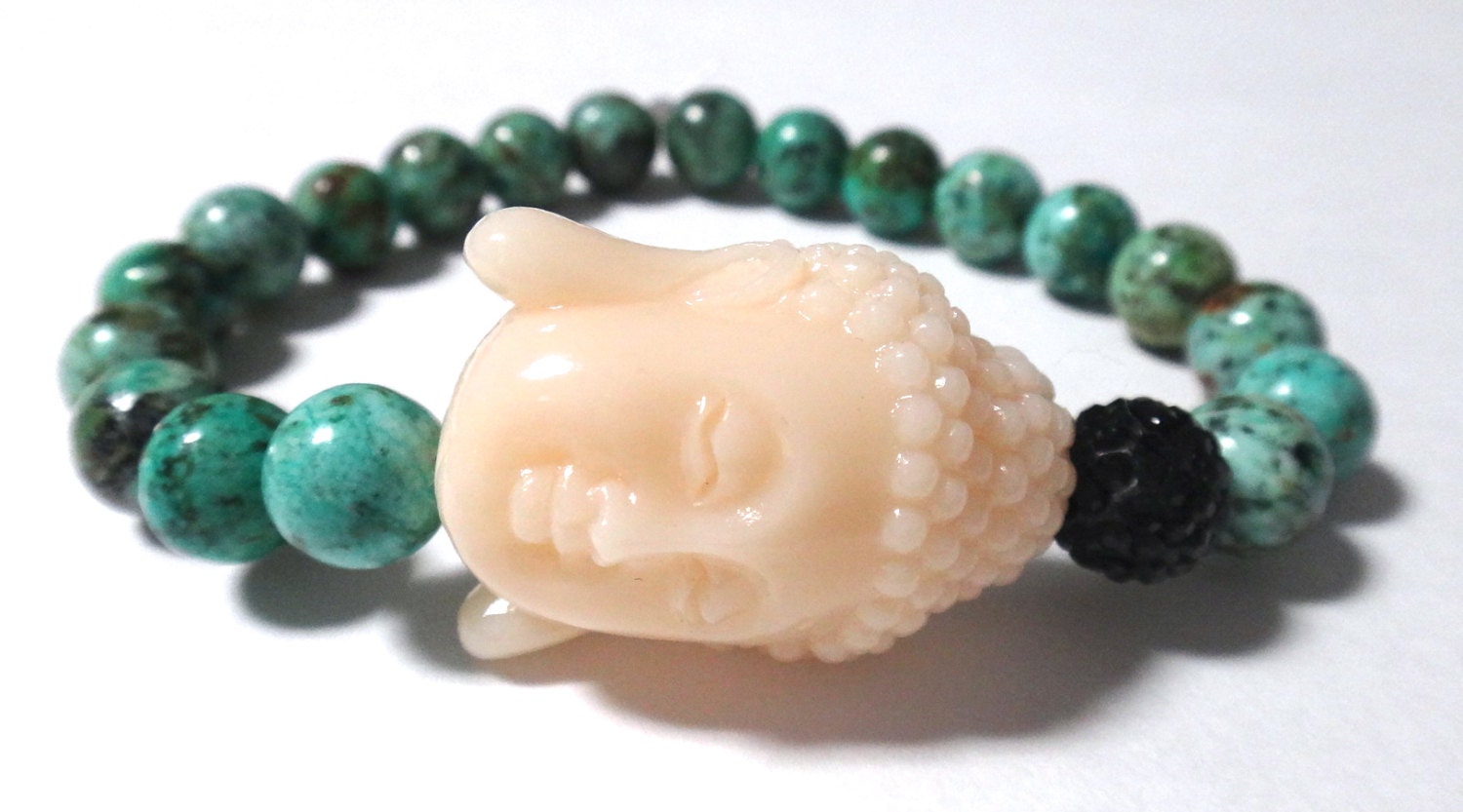 African Turquoise Beaded Bracelet with White Buddha and Black Rhinestone Bead