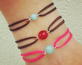 Friendship bracelet, glass bead, neon pink nylon cord