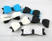 black and white felt bow barrettes attached to a snap clip barrette, black and blue