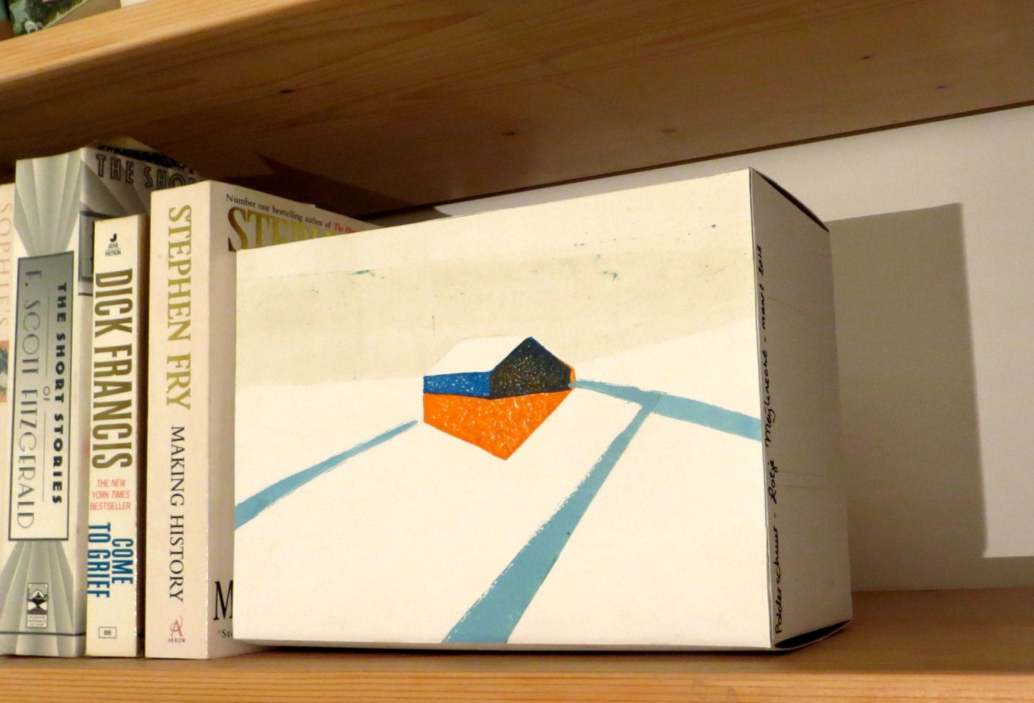 Handprinted house in snow lino-cut, a solo stand-up block art object
