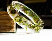 resin bangle bracelet full of floating real botanical emerald green moss. studiobotanica. fashion.