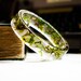 resin bangle bracelet full of floating real botanical emerald green moss. studiobotanica. fashion.