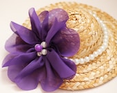 Small straw fascinator hat with violet flower