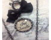 Just Breathe soldered oval pendant on toggle chain 