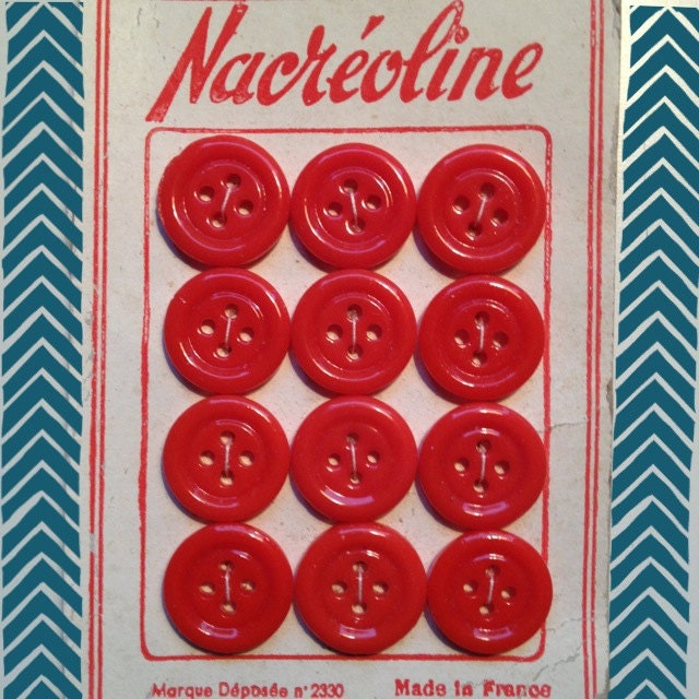 Vintage red glass buttons still on card, from France.