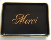 M gold Merci black tray