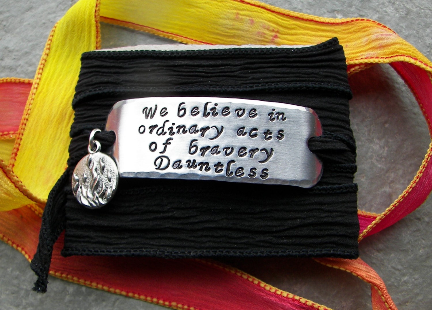 Hand Stamped Divergent Faction Bracelet - Dauntless on 100% Silk Ribbon with Fire Charm