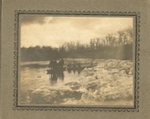 Vintage Photograph of People in Canoes on Icy River
