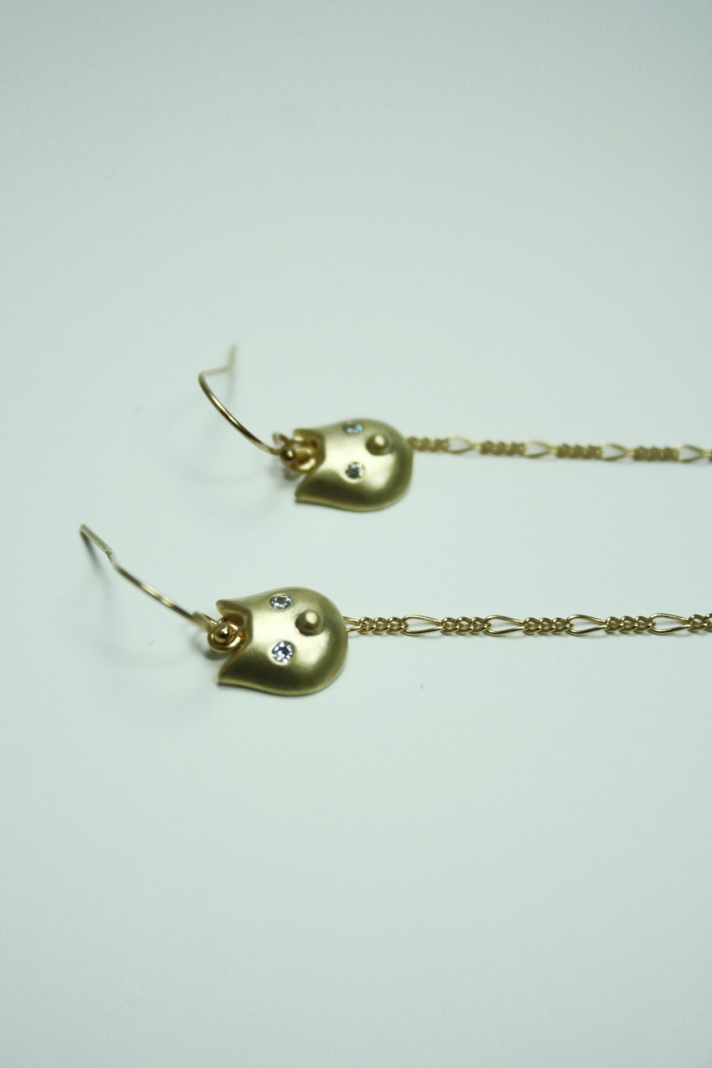 Gold cat earrings with baby stars
