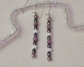 Dangling earrings of violet and white with  hematite