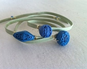 Cinnabar Wrap Bracelet: Triple Wrap in Celadon Green Leather with 3 Cyan Blue Carved Beads