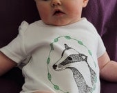 Badger Baby grow, hand screen printed on Organic cotton with eco-friendly inks. Badger in a circle of leaves
