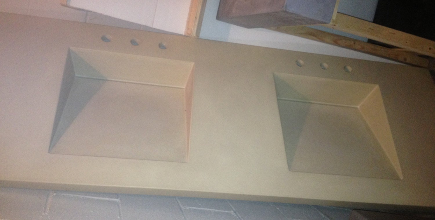 Tan concrete Vanity with double ramp sinks