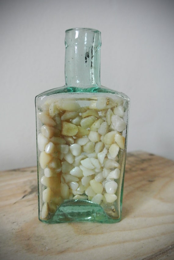 Human Denture Teeth Inside Of Antique Medicine Bottle featured image