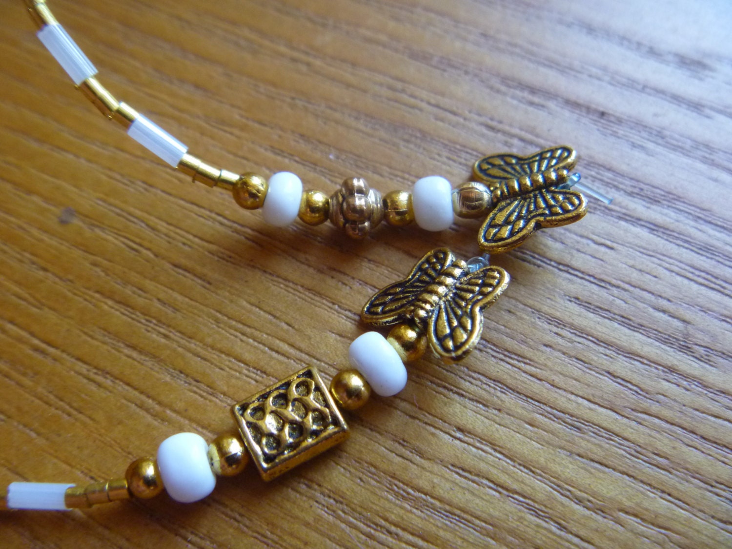 Beaded bookmark, gold and white with butterfly charms