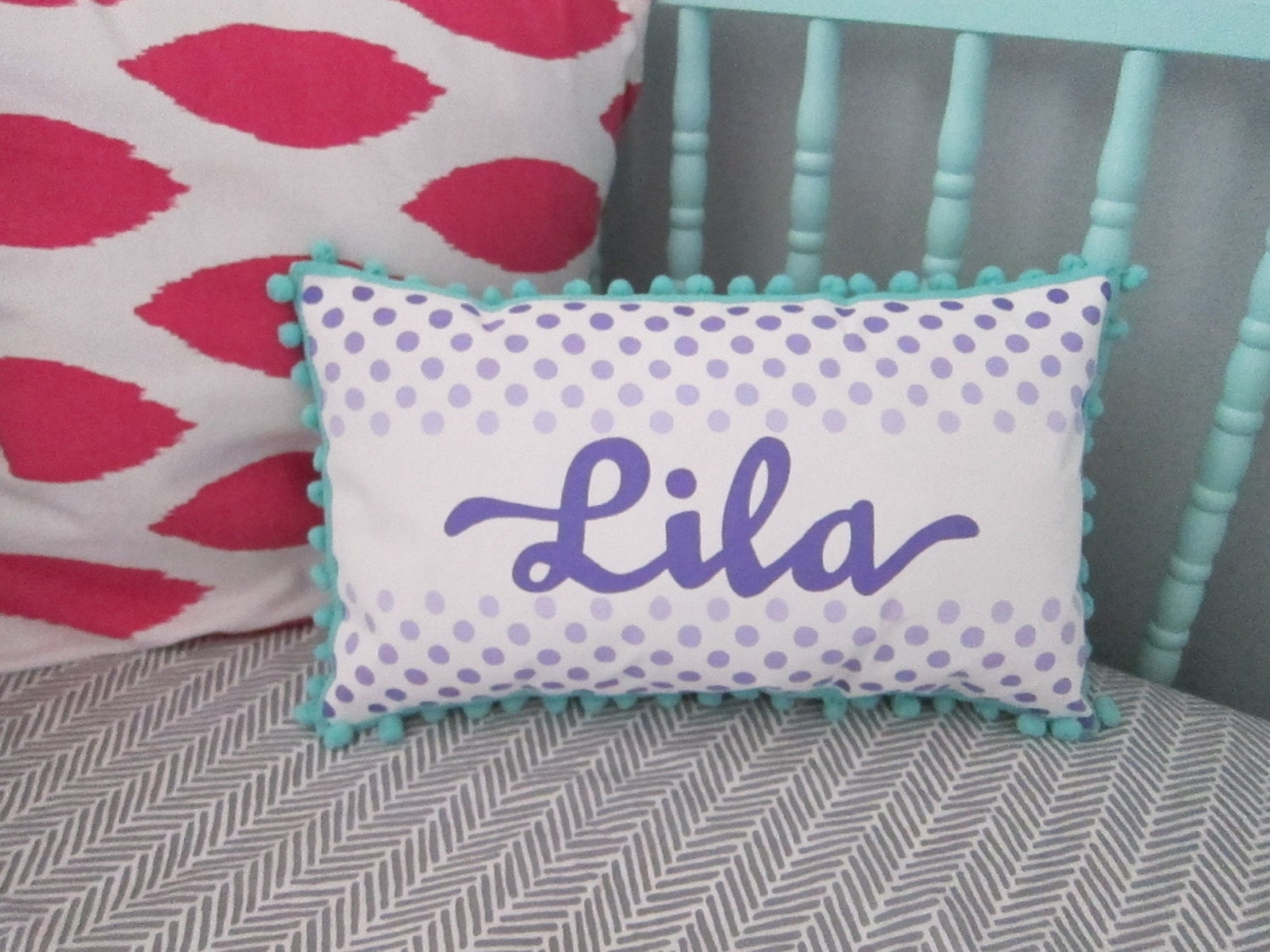 Pillow in purple ombre polka dots. Personalized with name.
