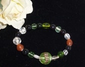 Handmade BRACELET with Glass Beads  Lime Green Black, Burnt Orange and Clear
