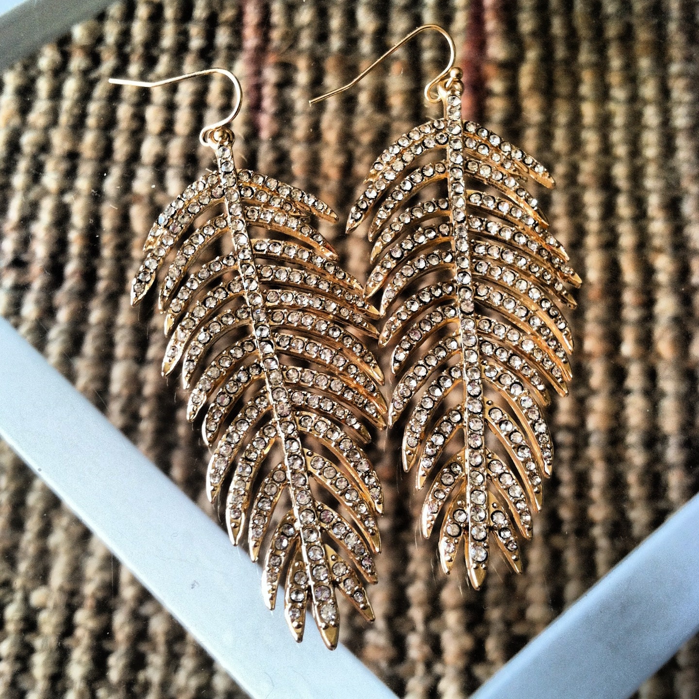Gold and rhinestone feather earrings