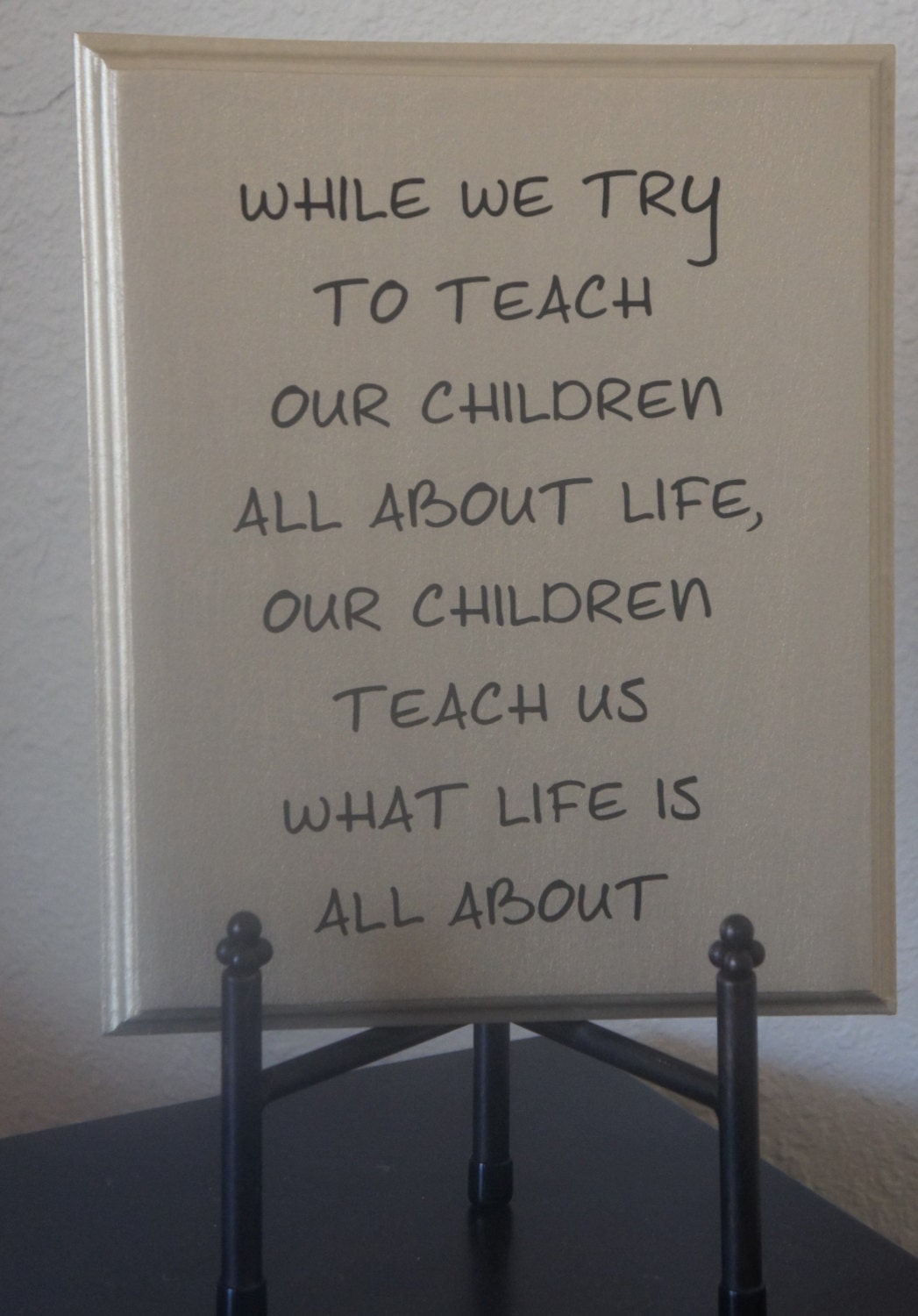 While we try to teach our children all about life, our children teach us what life is all about Solid Wood Plaque sign picture