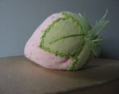 A charming pink strawberry pin cushion
