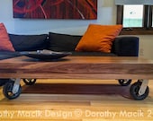 Custom Strip Coffee Table from Reclaimed Wood on Industrial Wheels